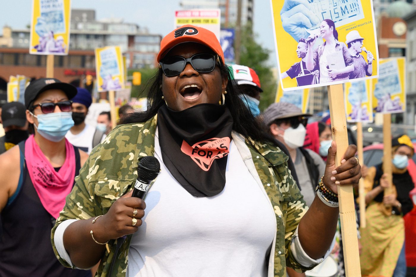 A speaker at a migrant workers and decent work rally