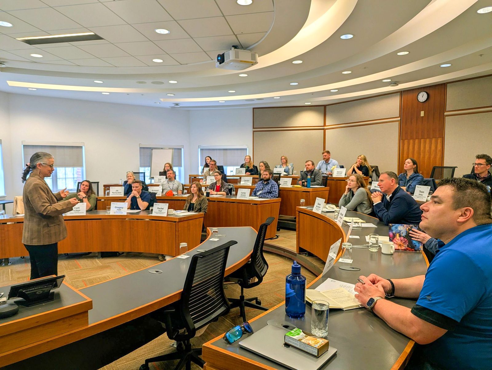 Leaders seated in a lecture hall during a conservation program session